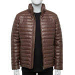 A luxury brown mens leather puffer jacket with horizontal quilting, a high-stand collar, and a tailored fit, showcased by Custom Jackets USA.