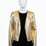 Detailed close-up of a metallic gold hand-woven leather coats for women showing the architectural texture.