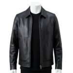 Detailed view of the classic point collar and smooth leather texture on a black jacket.