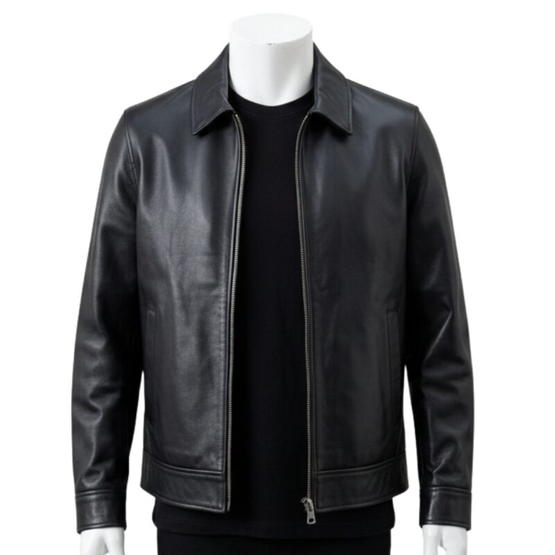 Detailed view of the classic point collar and smooth leather texture on a black jacket.