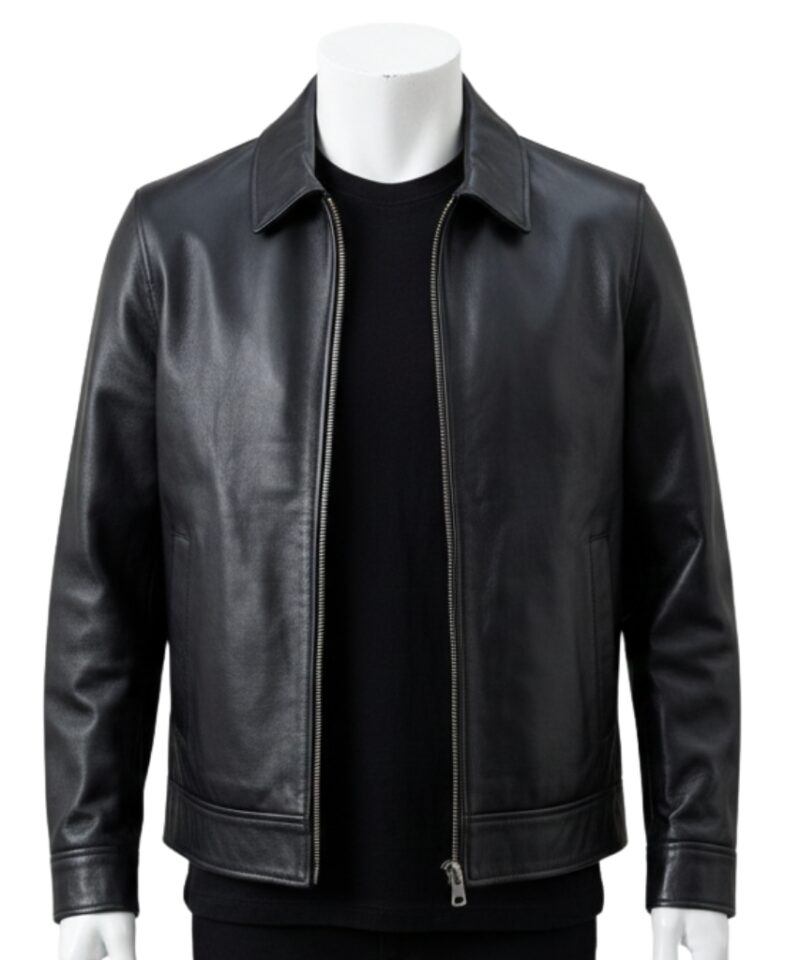 Detailed view of the classic point collar and smooth leather texture on a black jacket.