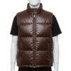 Detailed texture of the premium full-grain black leather on a wide-baffle puffer vest.