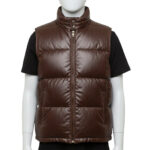 Detailed texture of the premium full-grain black leather on a wide-baffle puffer vest.
