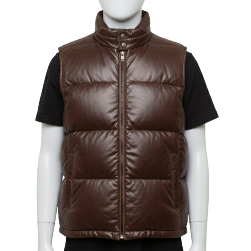 Detailed texture of the premium full-grain black leather on a wide-baffle puffer vest.