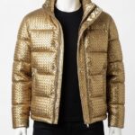 Man wearing a Custom Jackets USA metallic gold woven puffer jacket with horizontal quilting and a high stand collar against a clean white background.