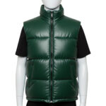 Close-up of the high-neck stand collar and zipper hardware on a green leather puffer vest.