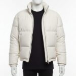 A premium ivory leather puffer jacket for men featuring a high stand collar and structured horizontal quilting.