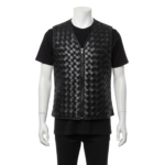 A man wearing a black woven leather vest for men with a center zipper and v-neck.