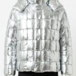 A man wearing a Custom Jackets USA metallic silver leather puffer jacket with a woven square pattern and high collar.