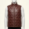 Stylish mahogany brown mens leather puffer vest with a high stand collar on a mannequin.