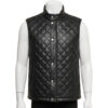 Detailed view of the diamond quilting and snap button closure on a leather puffer vest.