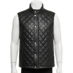Detailed view of the diamond quilting and snap button closure on a leather puffer vest.