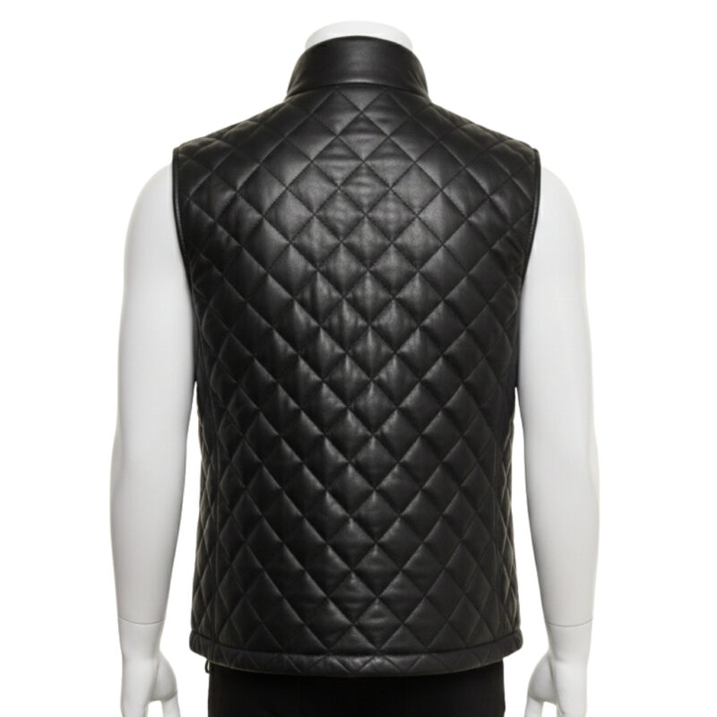 Detailed view of the diamond quilting and snap button closure on a leather puffer vest.