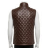 Mannequin wearing a men's rich brown diamond-quilted leather puffer vest with silver snap buttons and a stand-up collar.