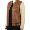 A high-end cognac and cream ostrich leather varsity jacket for women.