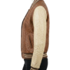 A high-end cognac and cream ostrich leather varsity jacket for women.