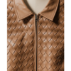 A handcrafted tan woven leather collar vest women showing the womens leather vest texture.