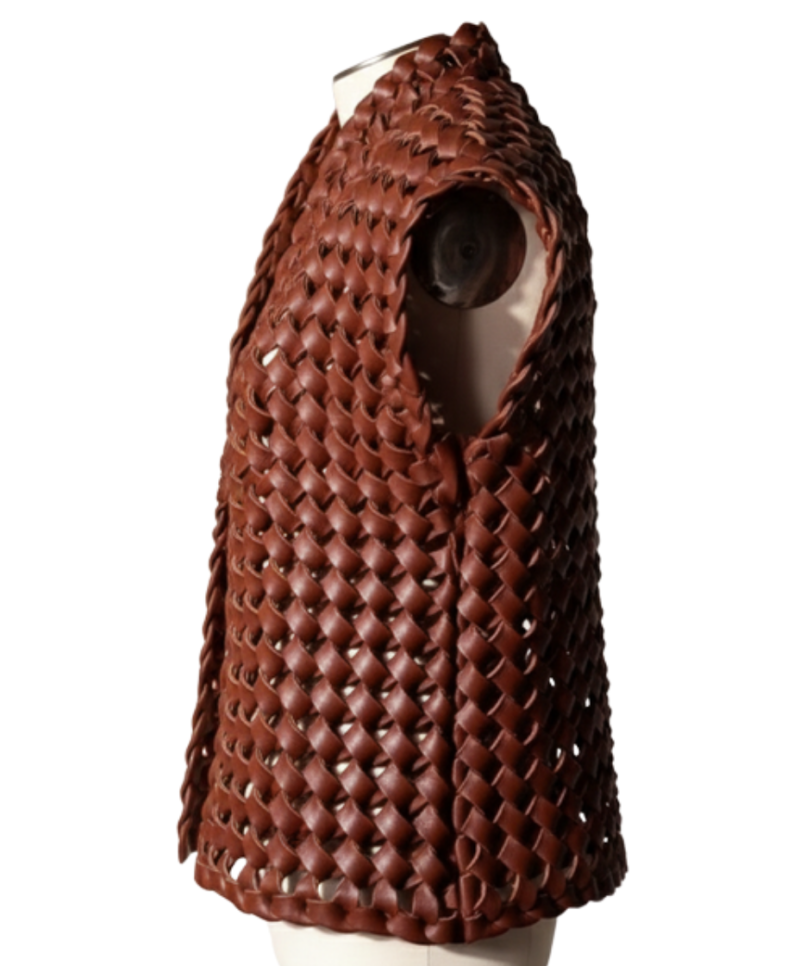 A handcrafted burnt maroon interlaced leather gilet women showing the womens leather vest jacket texture.