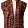 A handcrafted burnt maroon interlaced leather gilet women showing the womens leather vest jacket texture.