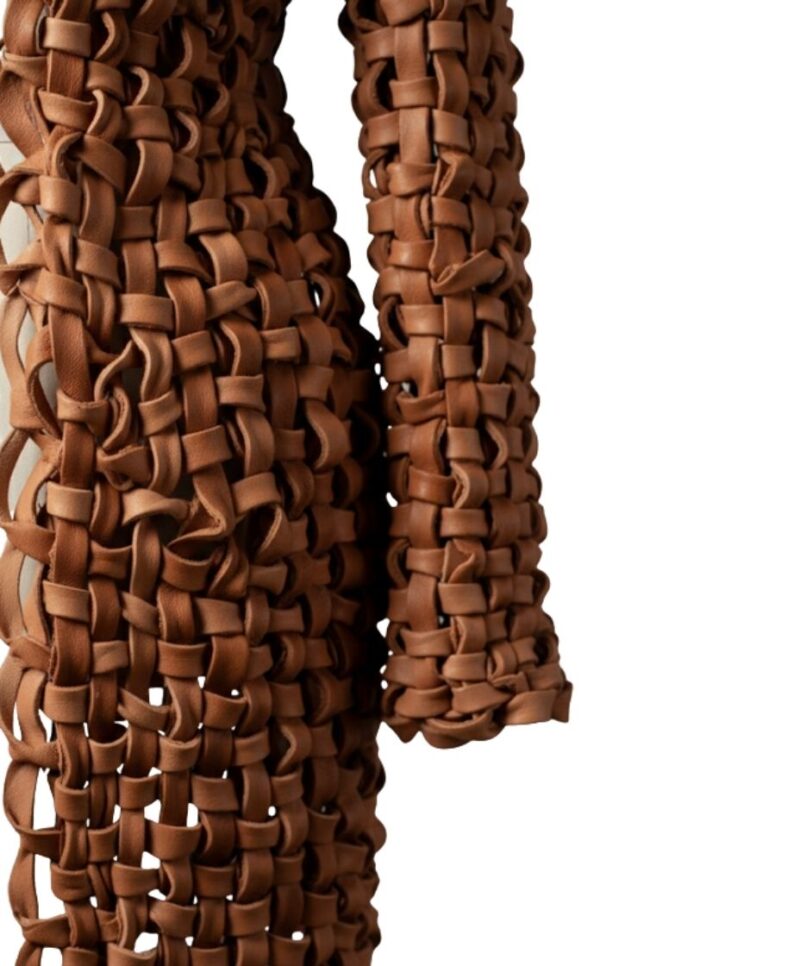 A high-end leather coat women featuring a detailed long leather coat women woven texture in saddle brown.