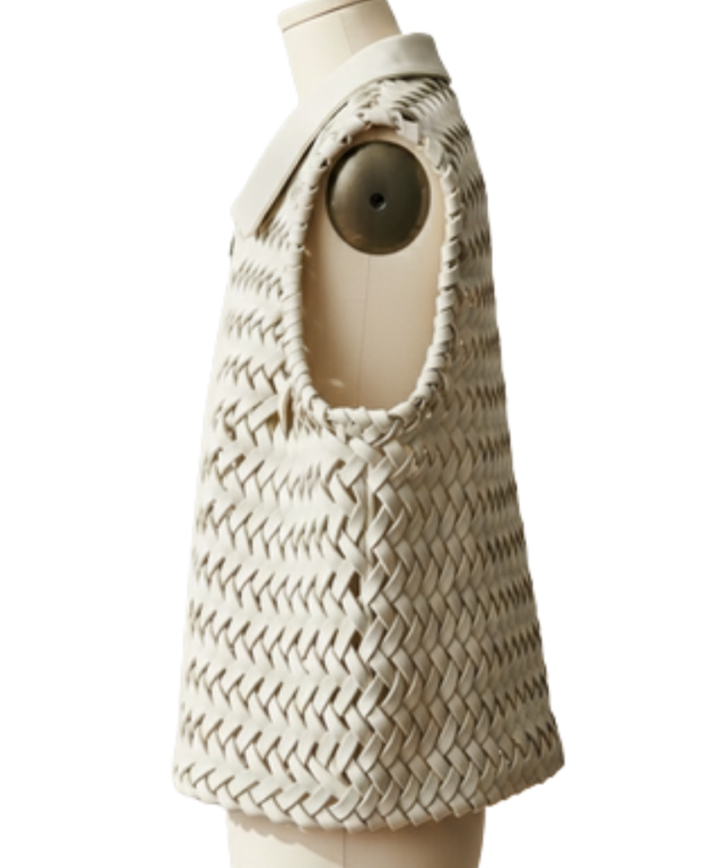 A handcrafted french grey braided leather gilet women showing the womens black leather vest texture.