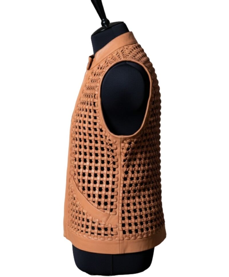 A high-end leather vest women featuring a detailed women's leather vest woven texture in pastel peach.
