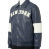 A luxury charcoal blue leather design featuring the navy blue varsity jacket style.