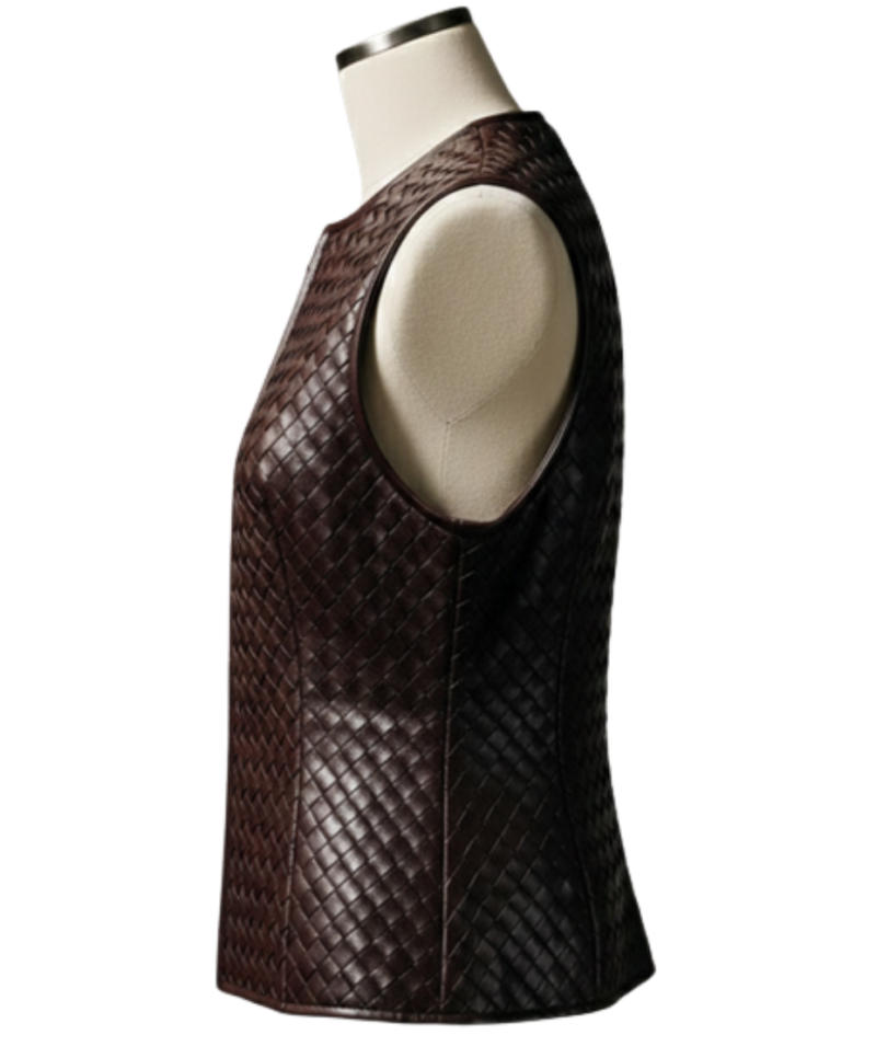 A handcrafted burnt coffee braided leather body warmer women showing the womens black leather vest texture.
