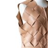 A high-end leather vest women featuring a detailed women's leather vest woven texture.
