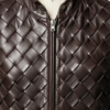 A handcrafted dark chocolate braided leather waistcoat men showing the mens leather vest jacket texture.