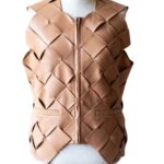 A high-end leather vest women featuring a detailed women's leather vest woven texture.