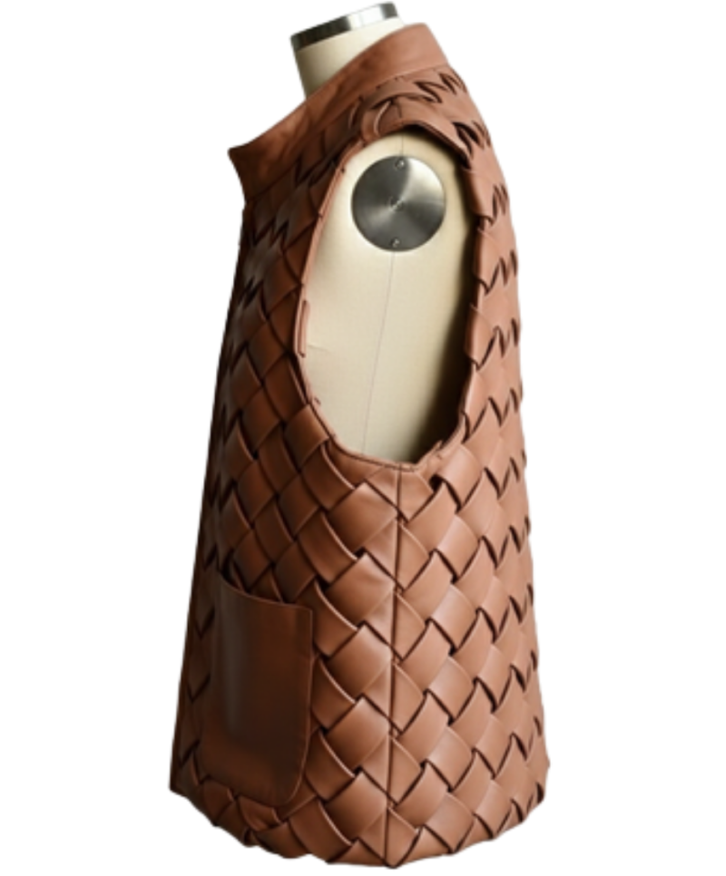 A handcrafted cognac interlaced leather gilet women showing the womens brown leather vest texture.