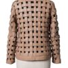 A high-end tan leather jacket featuring a detailed cream leather jacket woven texture.