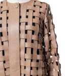 A high-end tan leather jacket featuring a detailed cream leather jacket woven texture.