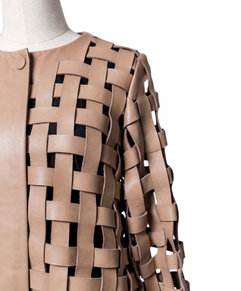 A high-end tan leather jacket featuring a detailed cream leather jacket woven texture.