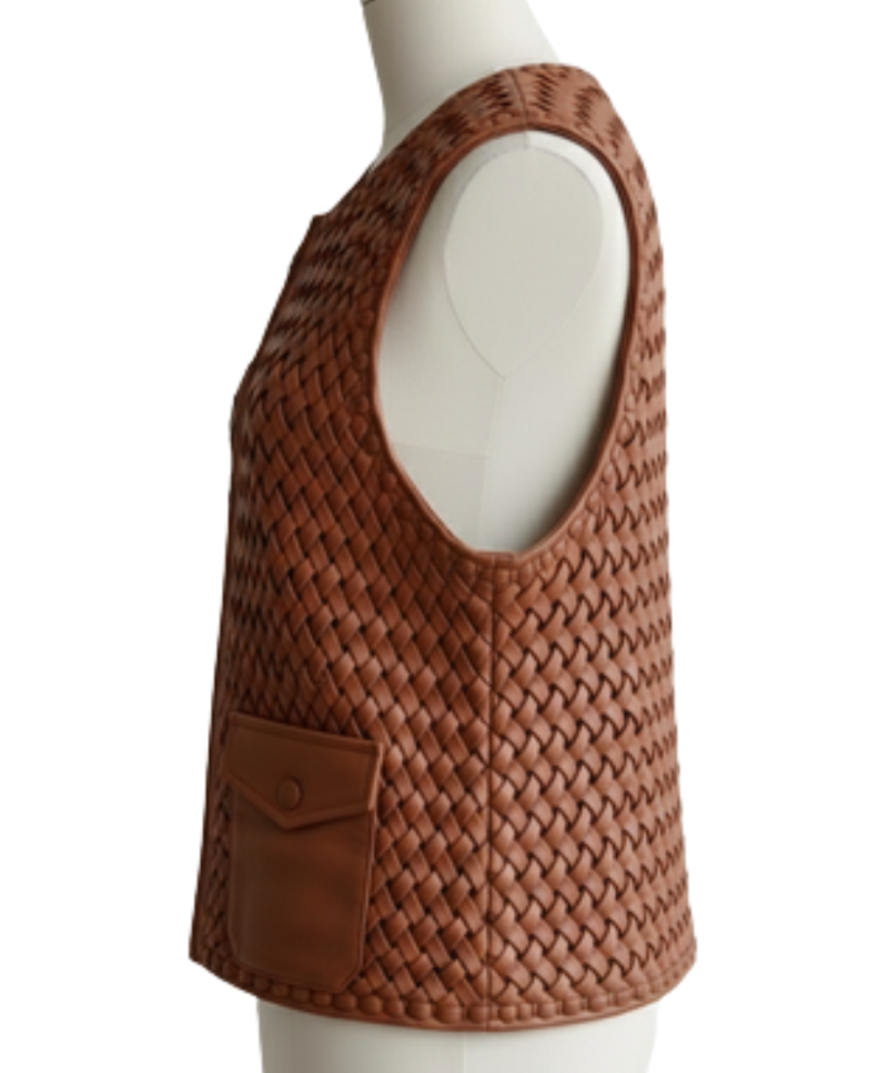 A handcrafted amber brown hand-woven leather body warmer women showing the leather motorcycle vest women texture.